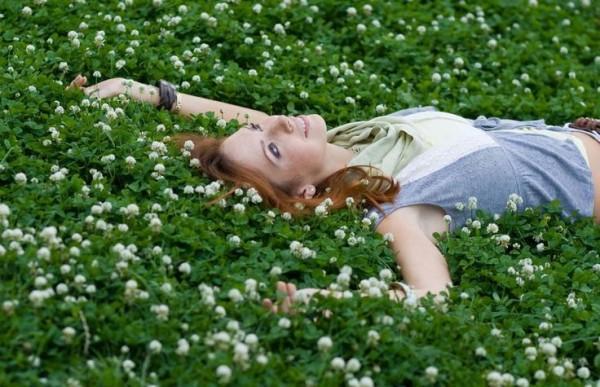 lady laying on grass