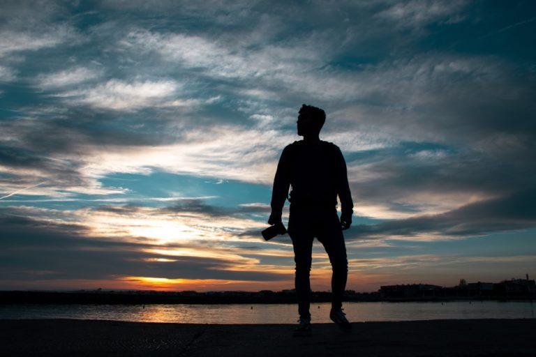 Man standing in seashore