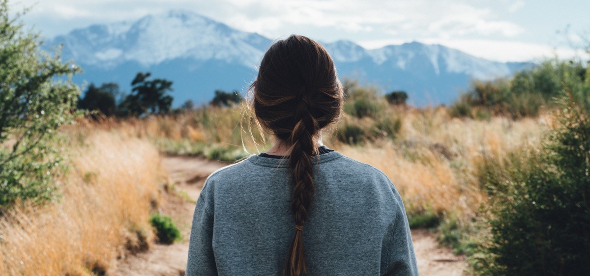 woman looking off into the mountains