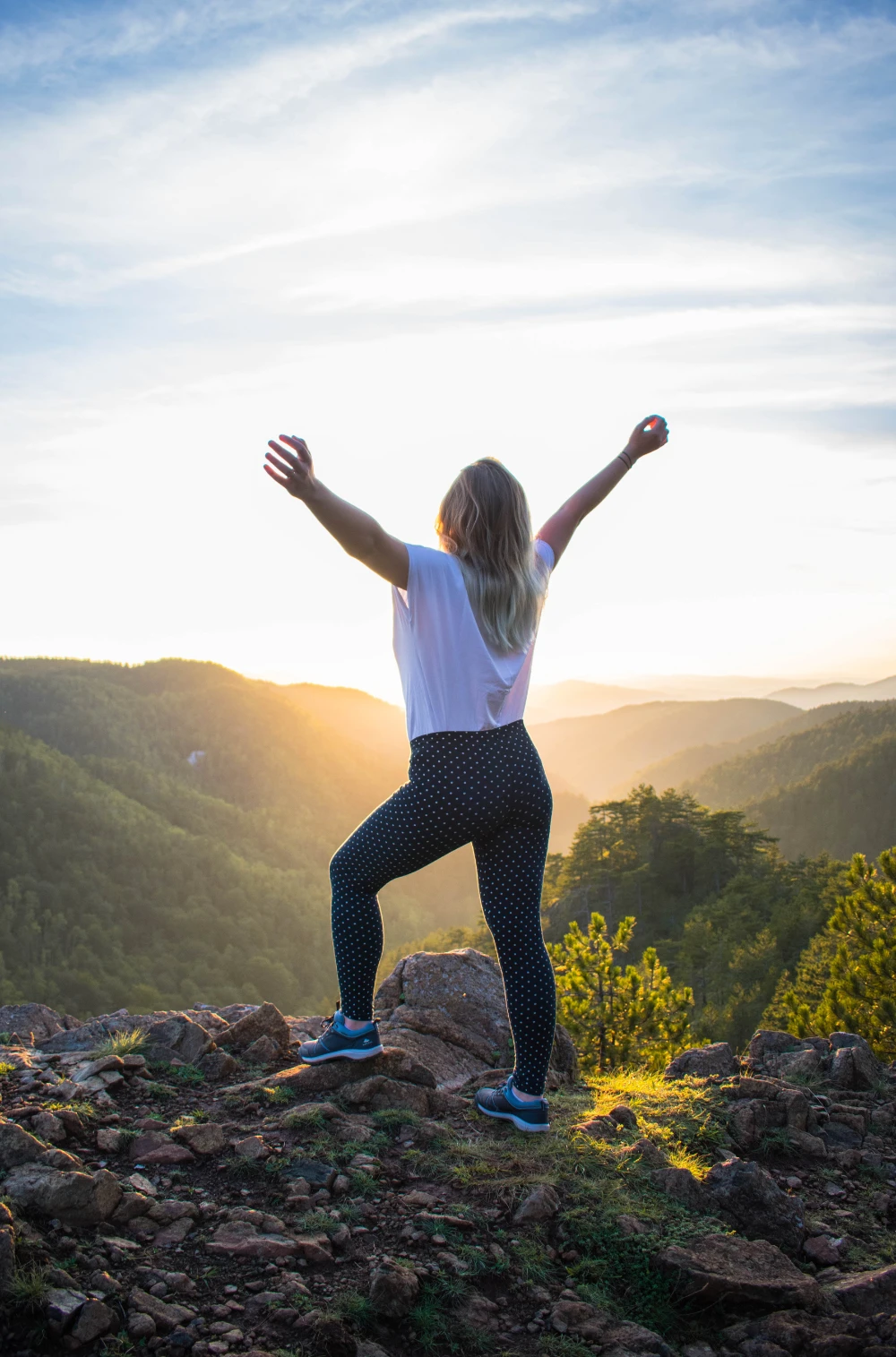 Happy woman on mountain top